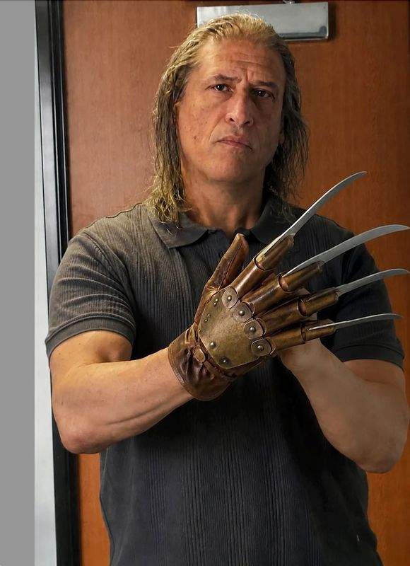 George S. Pogacich in Halloween costume with a bladed glove